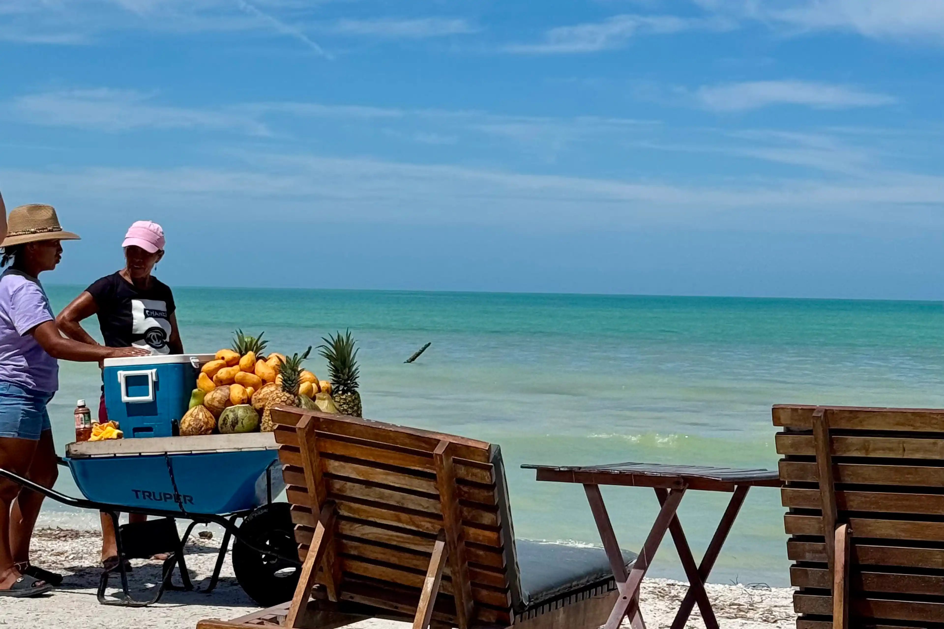 Street vendors selling fruit on Holbox Beach.